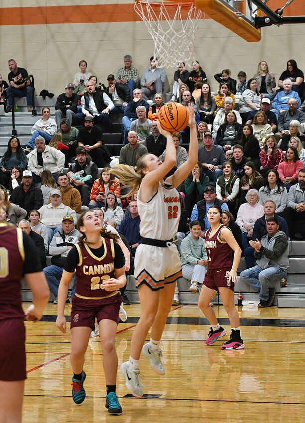 Kaegan Young (22) scores 2 of her game-high 22 points on Friday against Cannon County. Young finished with a double-double, pulling down 11 rebounds on the night. She also dished out six assists and swiped five steals.