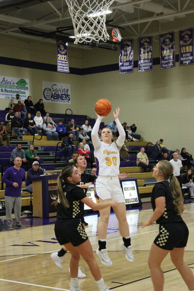Shelbyville transfer Morgan Pridemore (30) lines up a three-pointer against Clay County in Friday night's overtime win.