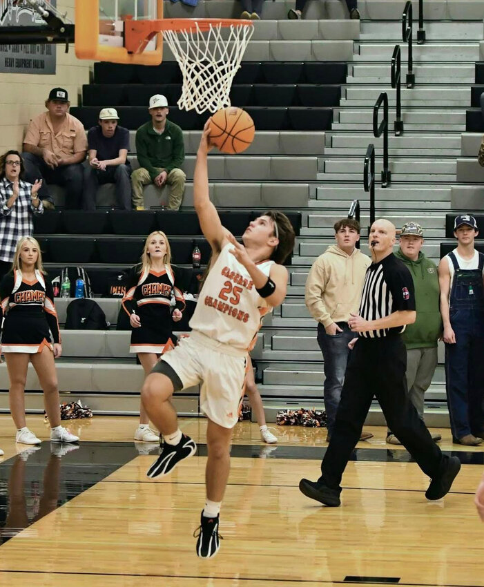 Tyler Rodgers (25) lays in two of his game-high 18 points in Monday's win over Murfreesboro Central Magnet. Rodgers went a perfect 5/5 from downtown in the first half.