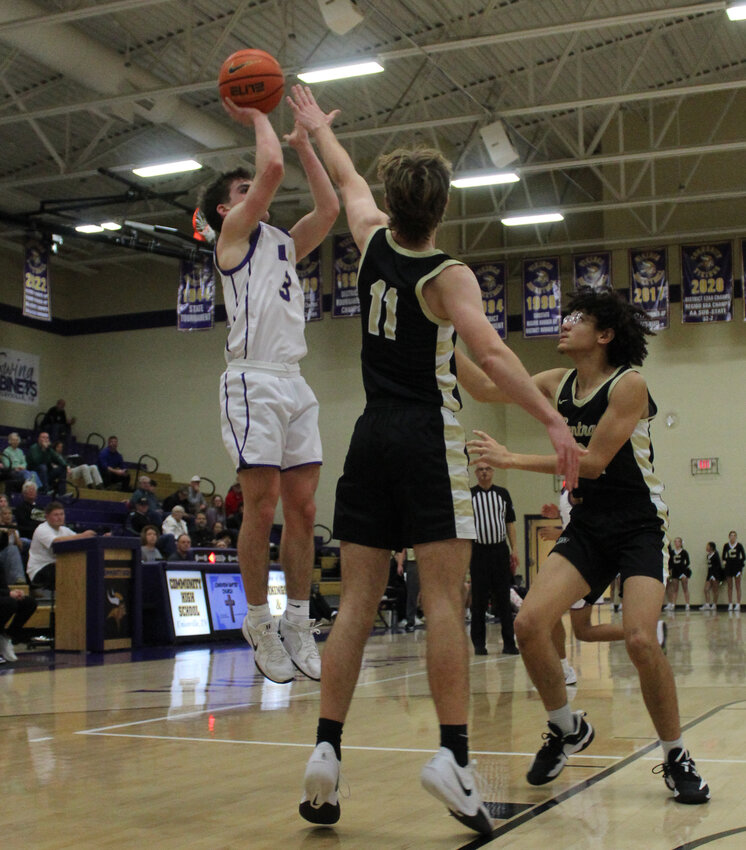 Charlie Haskins (3) scores two of his game-high 31 points in Thursday's win over Central Magnet.