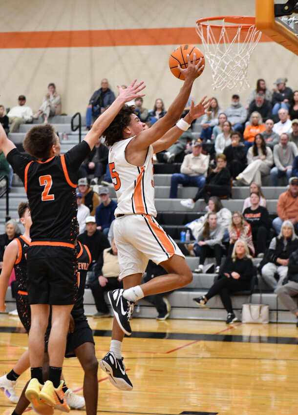 Kaleb Kelso (5) lays in two of his game-high 21 points in Friday's 25-point win over the Tigers. Kelso finished with a double-double, pulling down 10 rebounds as well as dishing out four assists.