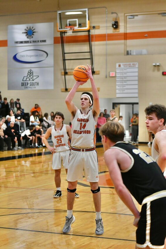 Cooper McElroy (14) led Cascade with 13 points and six rebounds in the district opening two-point loss against Loretto on Friday.
