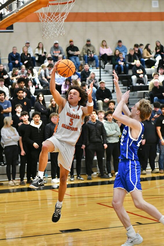 Kaleb Kelso (5) lays in two of his game-high 17 points in Friday's 58-37 win over Chapel Hill to improve to 2-1 in District 9-AA