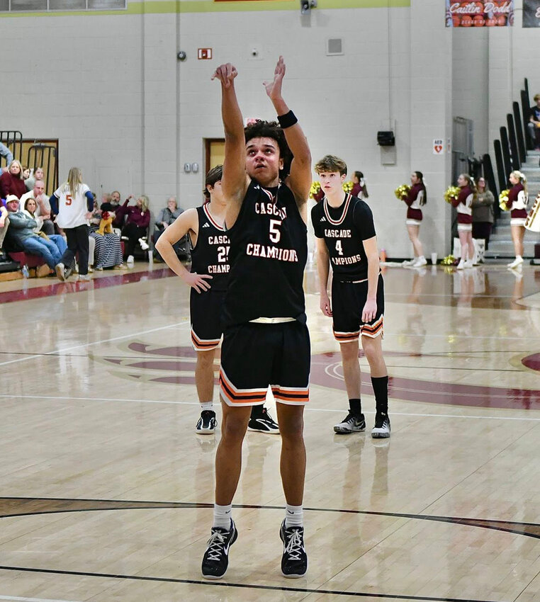 Kaleb Kelso (5) knocks in a free throw at No. 3 Cannon County. Kelso led the Champions with a team-high 20 points in Tuesday's win.