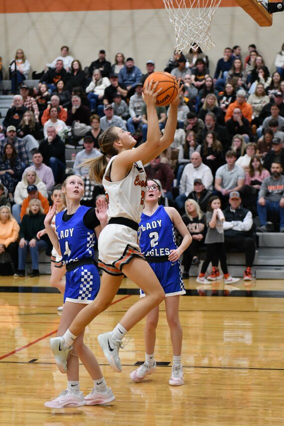 Kaegan Young (22) soars in for two of her game-high 18 points in Thursday's District 9-AA win over Summertown.