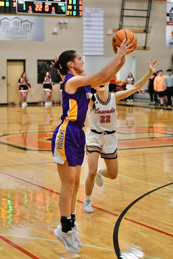 Community's Anna Haskins (3) fires away from downtown in the first half of Community's wire-to-wire upset win over No. 7 Cascade on Tuesday night. Haskins finished with a game-high 15 points on the night to lead the Viqueens.