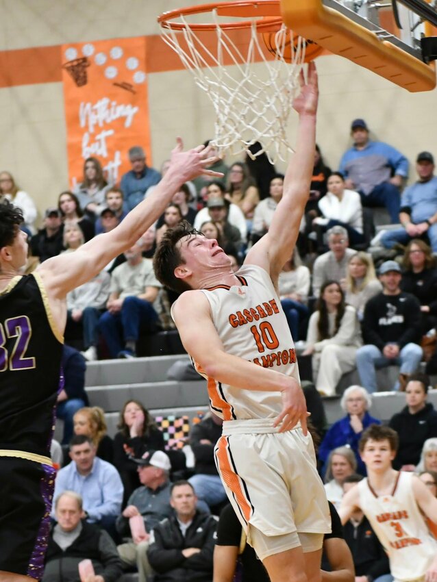 Cascade's Henry Stone (10) lays in two of his game-high 18 points in Tuesday's rivalry win over the Vikings.