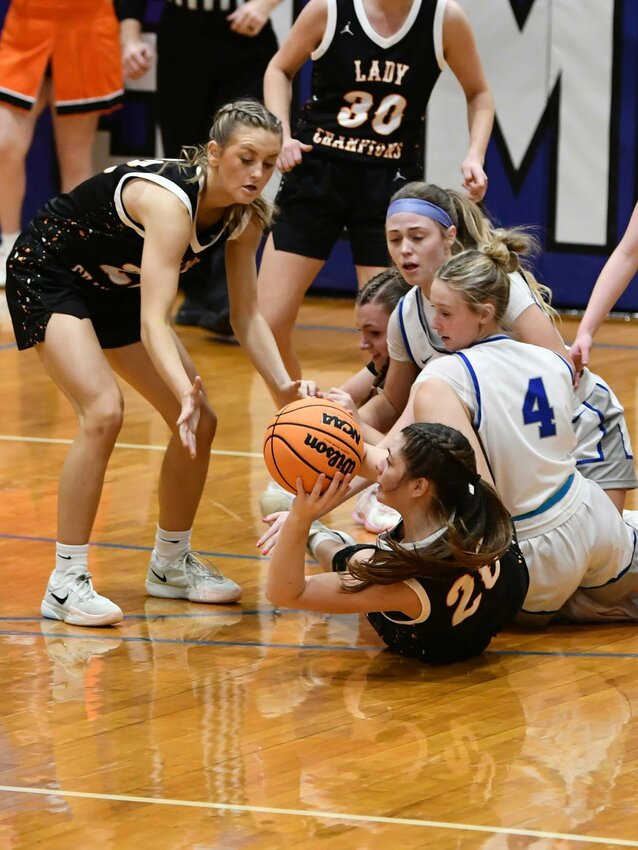 Cascade's Jade Tolar (20) gets on the floor and attempts to pass to her teammate Kaegan Young (22) in the first half of the Lady Champions' win at Summertown. Young was named as a finalist for the Class 2A Miss Basketball Award on Thursday, and she became the program's new all-time leading scorer on Friday, surpassing the previous record of 1,464 career points set by Heather Walling in 2000.
