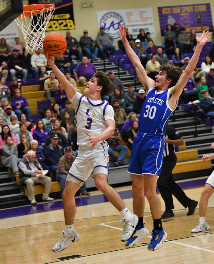 Community's Charlie Haskins (3) lays in two of his season-high 37 points in Tuesday's win against Chapel Hill.