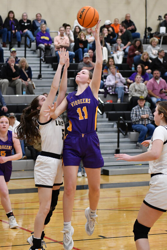 Community's Alyssa White (11) goes up for two of her eight points in Thursday's loss to Loretto.