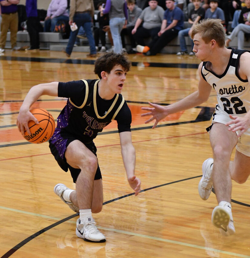 Community's Charlie Haskins (3) crosses over on Loretto's Grant Fisher (22) in the first half of the Vikings' loss to the Mustangs on Friday. Haskins scored 10 of his 12 points in the first half.