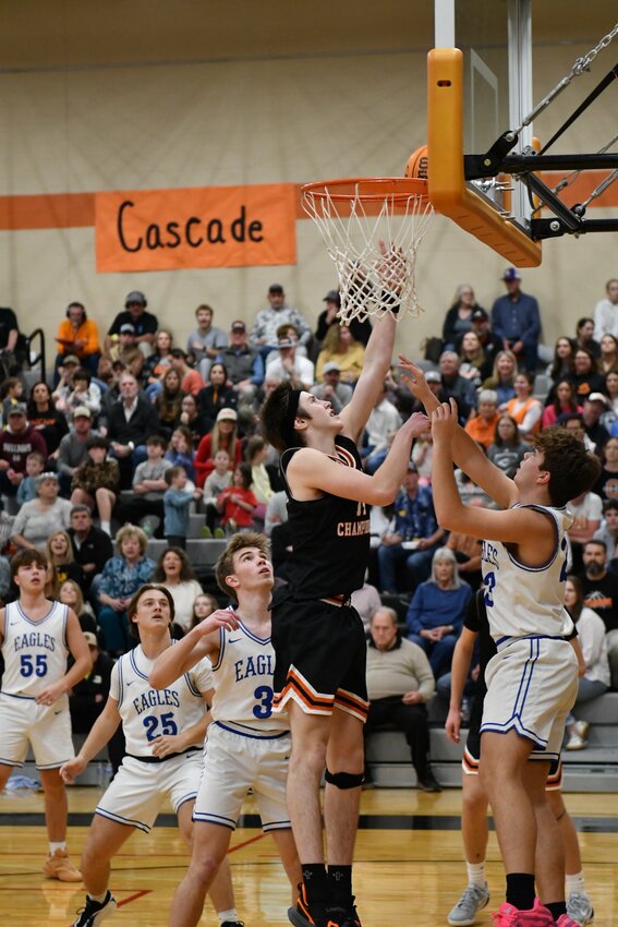 Cascade's Cooper McElroy (14) lays in two of his team-high 15 points in Friday's loss to Summertown.