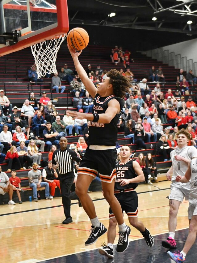 Cascade's Kaleb Kelso (5) goes up for two of his team-high 17 points in Saturday's win at Hickman County. Kelso also pulled down seven rebounds.