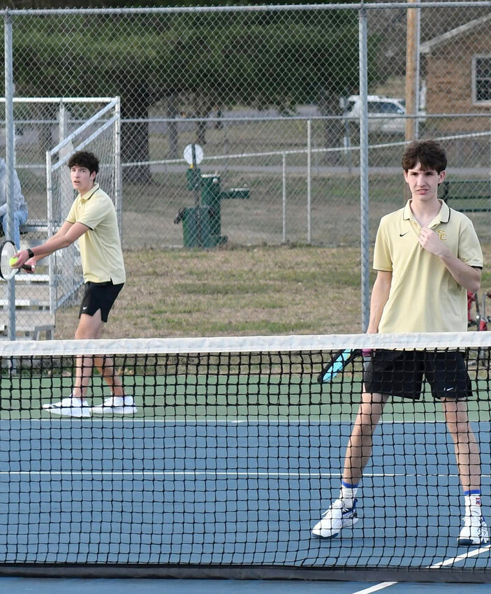 Shelbyville's Carter Watson (serving) and Tanner Johnson took down the Pioneers' duo of Christopher Sandoval and Sabastion Campos 8-0 in the doubles matches on Thursday. In their singles matches, Watson beat Sandoval 8-4 while Johnson beat Compos 8-2.