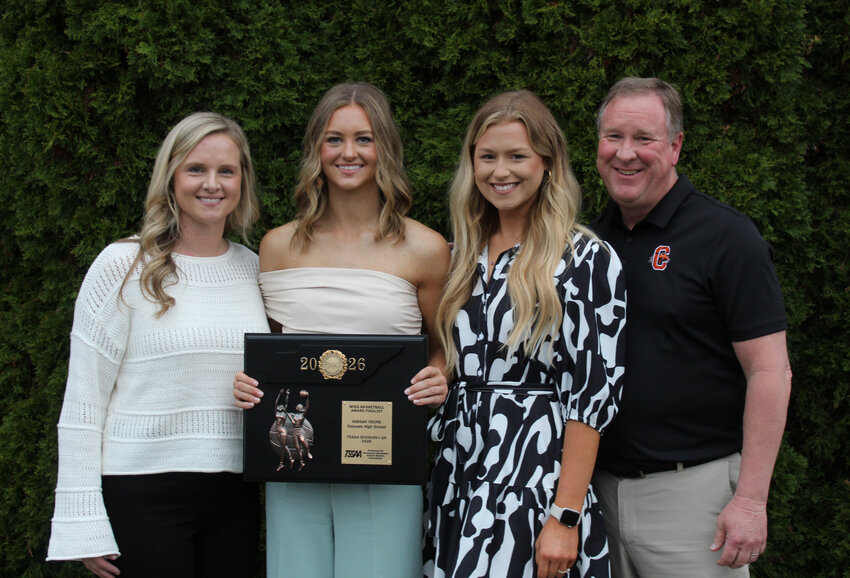Kaegan Young (center left) with her coaches - (from left to right) Janie Demonbreum, Kaylee Adams, and James Woodson - following the 2025-26 TSSAA Mr. &amp; Miss Basketball Award ceremony on Tuesday.