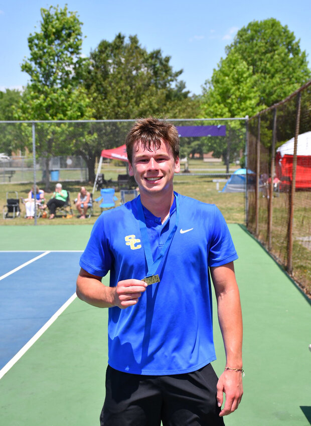 Shelbyville Central's Henry Stone with his first-place medal after winning the District 6-AA Individuals Tournament on Thursday.