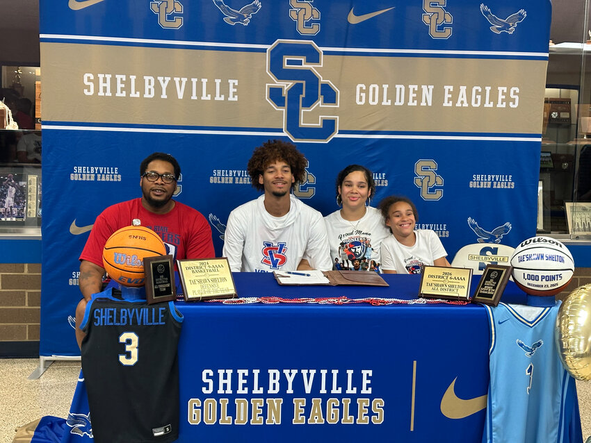 Shelbyville Central's Tae'Shawn Shelton (middle) signed with Vol State on Friday to continue his playing career at the next level.