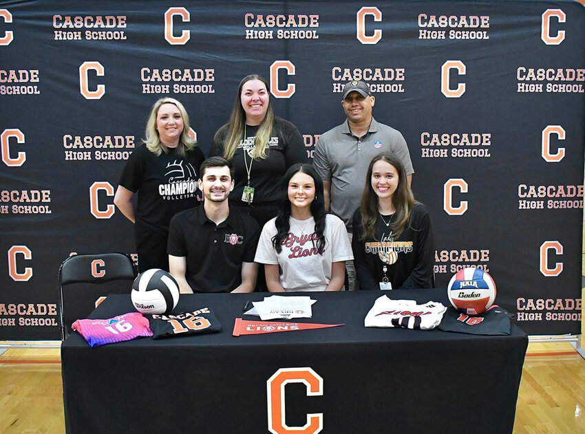 Cascade's Sydney Neal (middle) after signing with Bryan College on Friday morning.