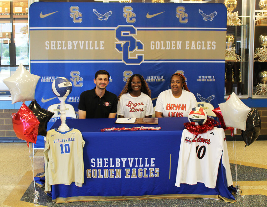 Shelbyville Central's Kyrianna Ward (middle) signed with Bryan College on Friday afternoon to continue her playing career.