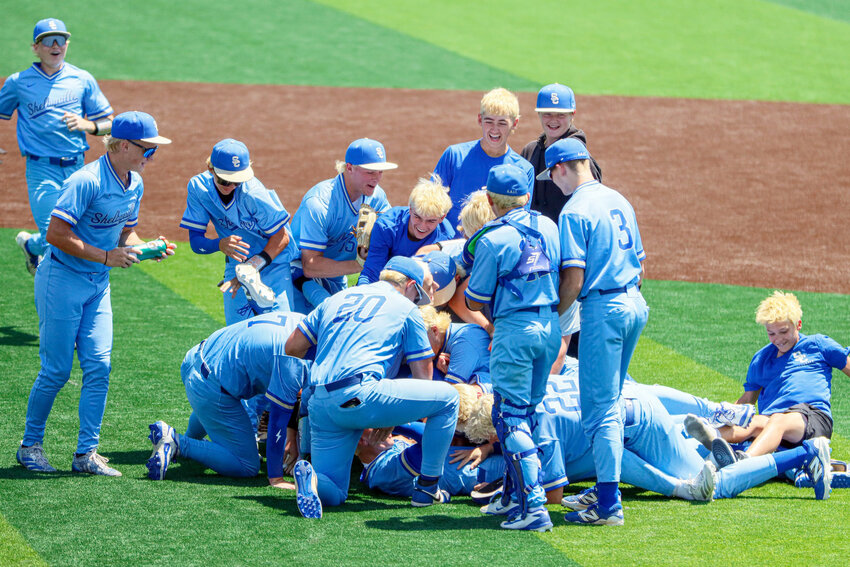 Shelbyville Central dogpiles after sweeping Hendersonville in the sub-state round on Friday afternoon.