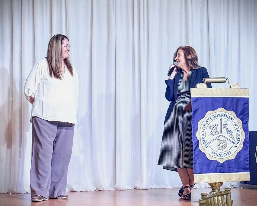 At a recent banquet honoring retirees, Superintendent Dr. Tammy Garrett, right, praised long-time educator Whitney Yoes for her dedication to always putting students first. Yoes and Garrett both retired at the end of the school year.