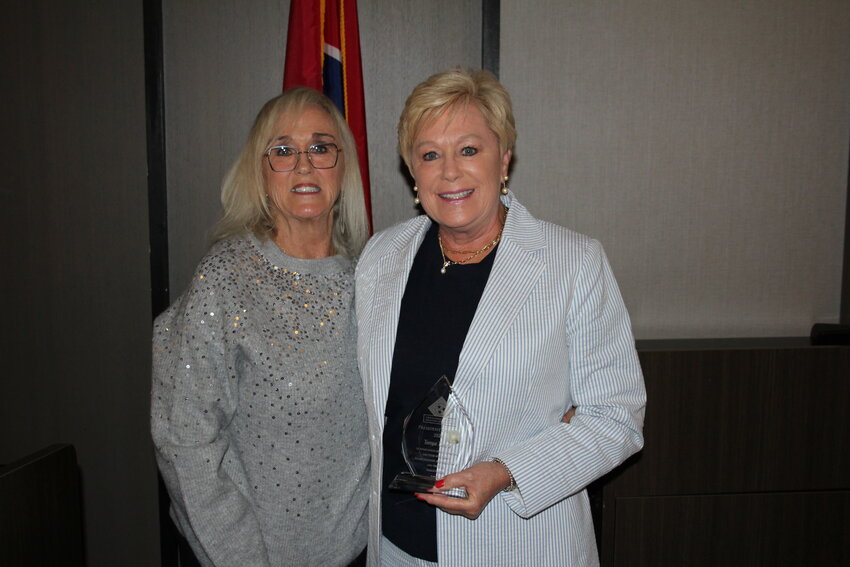Tonya Davis, BC Trustee, right, accepts an award for outstanding leadership from her peers during a recent awards ceremony.