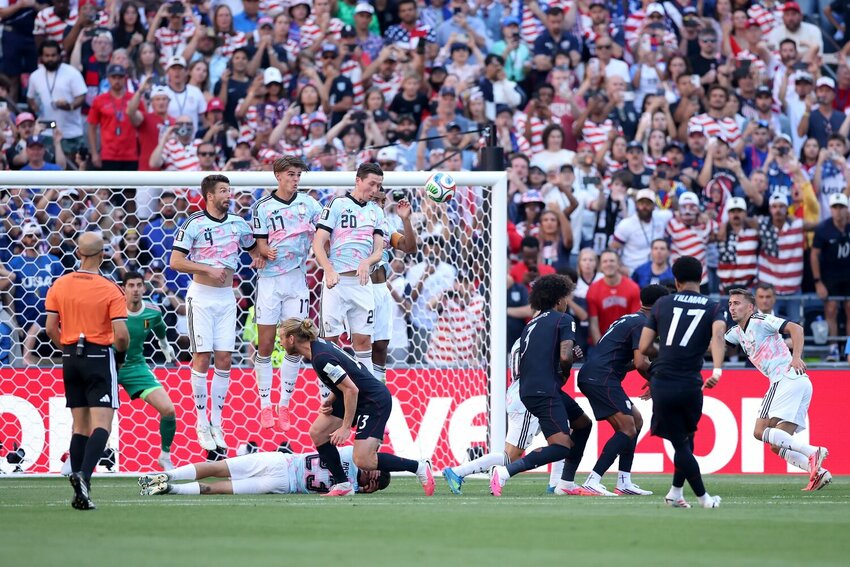 USA's Malik Tillman (17) fires a free kick into the Belgium net for the only American goal of the night in Monday's 4-1 defeat.