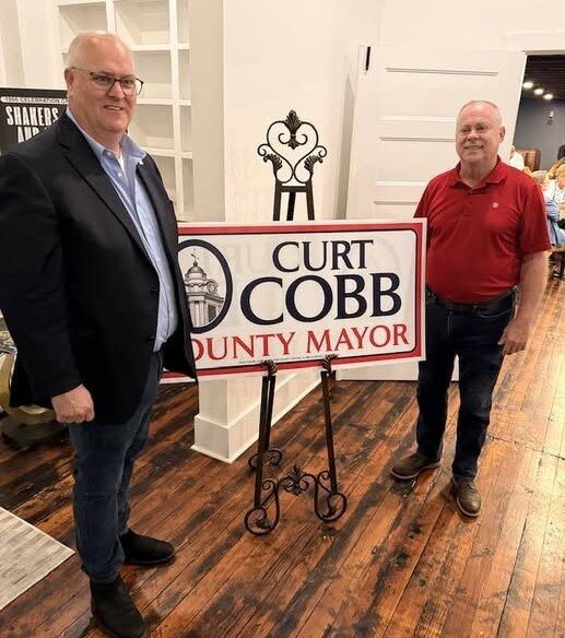 Mayor-elect Curt Cobb, left, and outgoing County Mayor Chad Graham