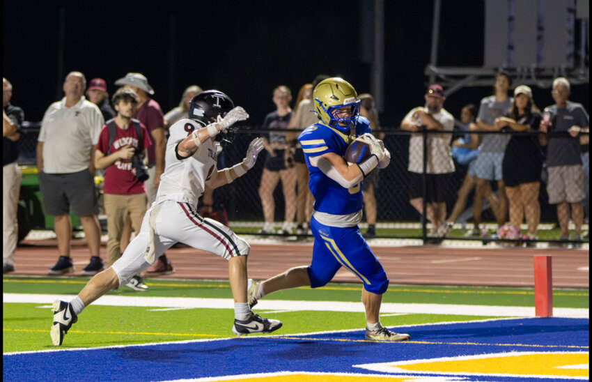 Shelbyville Central's Jackson Themm (5) hauls in the game-tying 25-yard touchdown in the win over Tullahoma on Friday. Themm finished with four receptions for 58 yards and the one score, all coming on the monumental scoring drive. Themm also kicked both field goals in overtime.