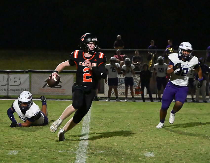 Cascade's Sam Bradley (2) evades pressure and looks to throw the ball downfield against Sequatchie County. Bradley tallied up 129 yards and two rushing touchdowns on 14 carries while finishing 10-of-21 for 81 yards passing in Friday's loss.