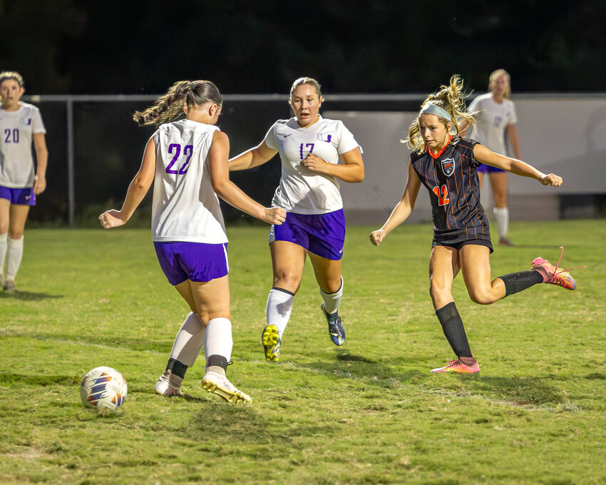 Cascade's Adalyn Nelms (12) scores Cascade's second goal of the night in Thursday's win over Community in the Battle of Bedford.