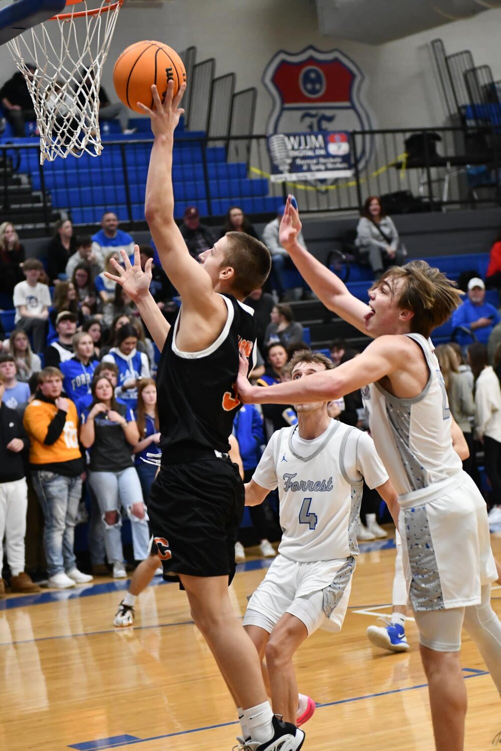 Wickey Parker (3 black) lays in two of his nine points on Tuesday.