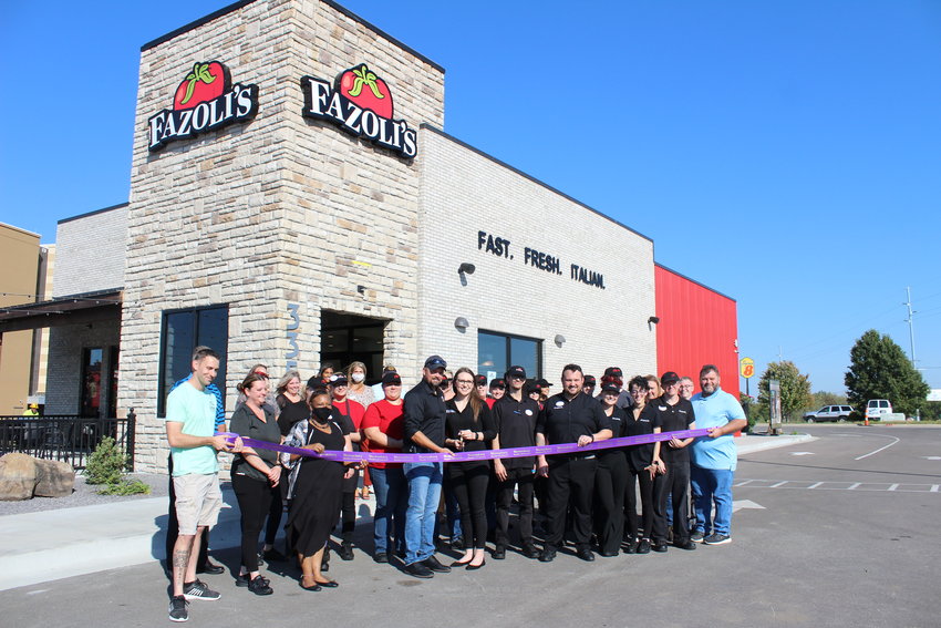 Fazoli&rsquo;s of Warrensburg owners Allison and Josh Kroeger cut the Warrensburg Chamber of Commerce&rsquo;s ceremonial ribbon on Monday, Sept. 27.