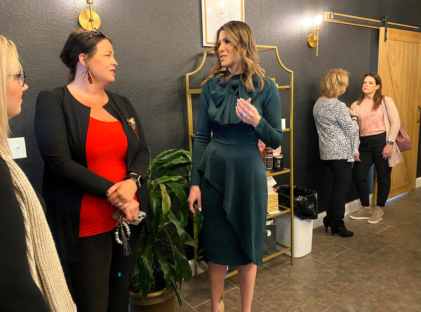 Parlour Seven owner Jessie Yarborough, right, talks with guests at her business during the Warrensburg Chamber of Commerce ribbon cutting on Thursday afternoon.