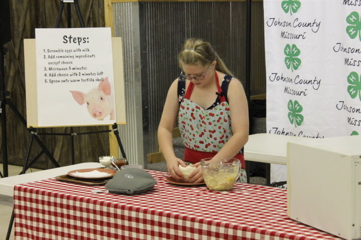 Mallory Hall of the Royal Clovers 4-H Club demonstrates how to make the “Ultimate Breakfast Burrito.”