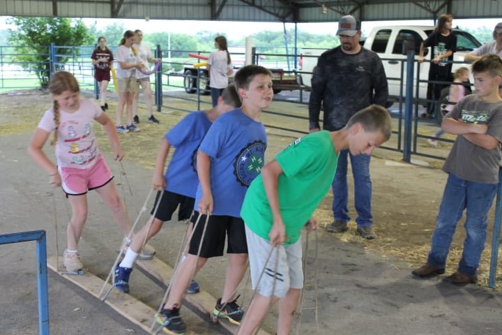 The Reserve Champion team from the Mt. Moriah Hustlers 4-H Club (Macy Jennings, Colby Davidson, Kyler Davidson and Brady Jennings) work as a team to master the “land skis.”
