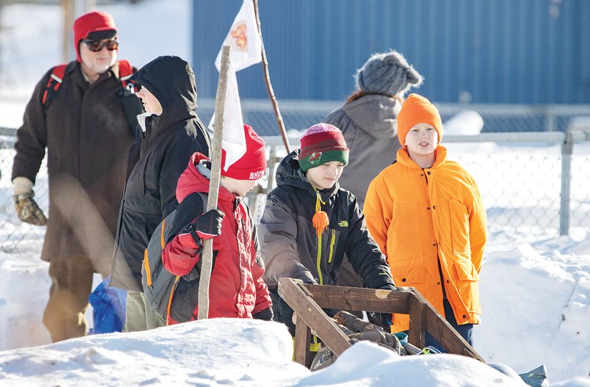 Cherry patrol members Joey Jude, Wyatt Kane, and James Stafsholt guide their Klondike sled toward their next skills test.
