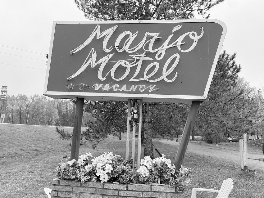 The Marjo Motel sign's neon glass tubes were broken by vandals. You can notice the broken glass tubing on the brick sign base.