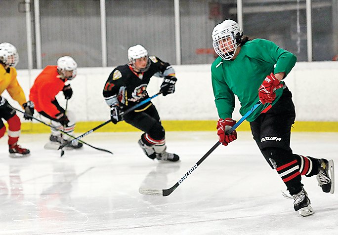 Ely hockey players go through the paces during a recent practice.