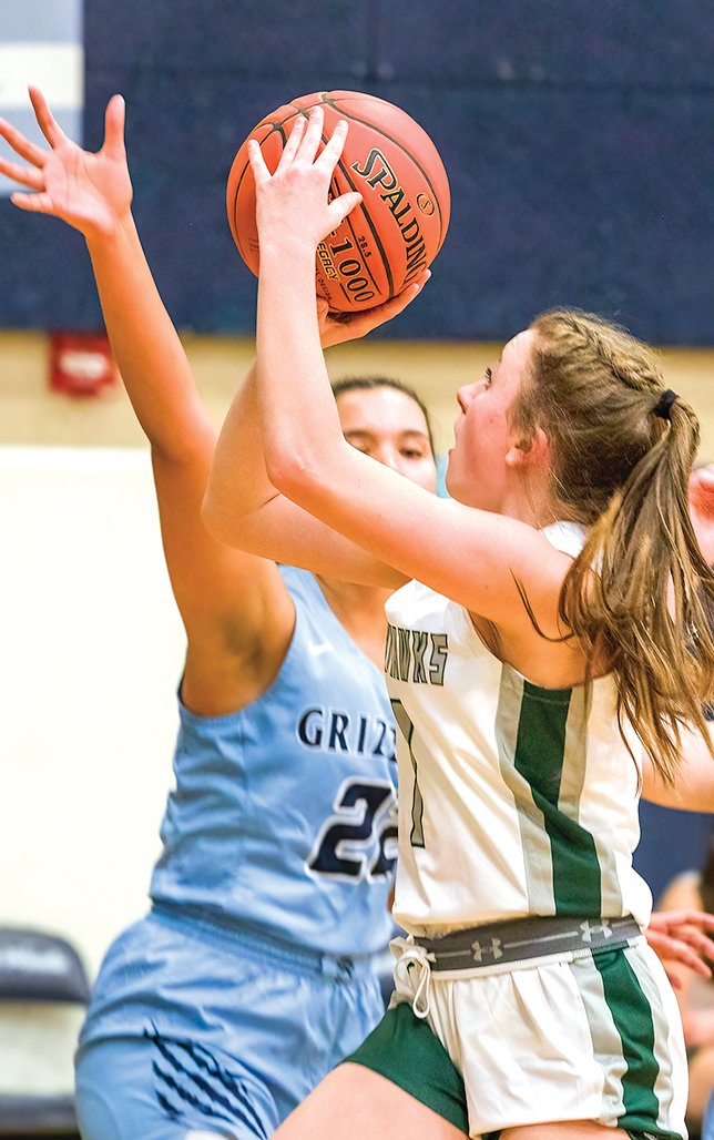 NER’s Maizy Sundblad goes up for a shot against the Grizzlies' Hannah Kinsey.