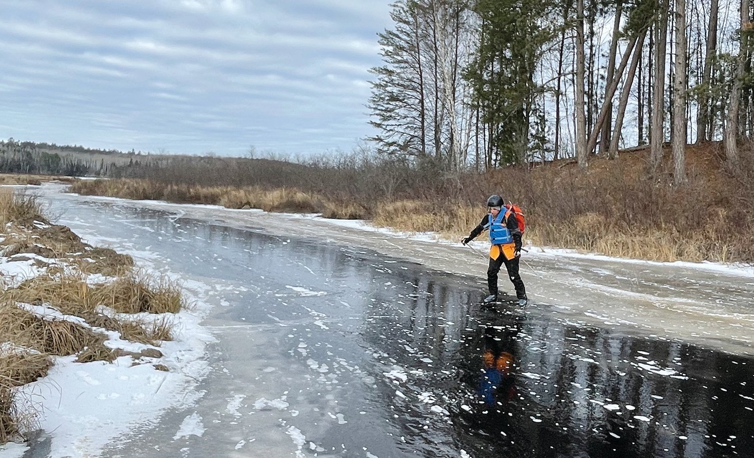 Testing fresh ice on the Moose River, north of the Echo Trail.