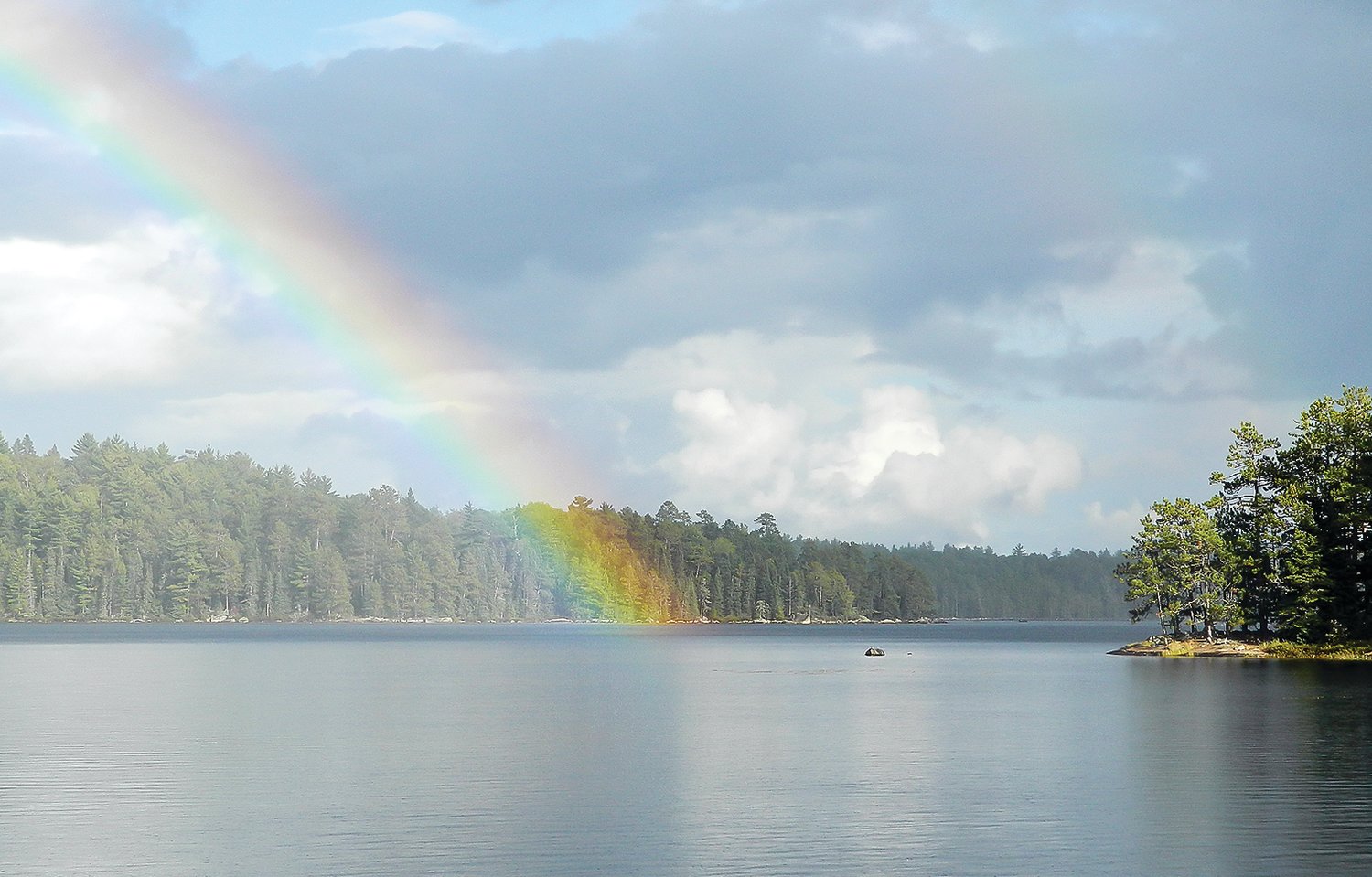 A rainbow appears to dip into the clear waters of Big Moose Lake in the Boundary Waters Canoe Area Wilderness. Fewer visitors may have access to Big Moose and the more than 1,000 other lakes in the 1.1-million acre wilderness as a result of entry permit reductions planned for 2022.