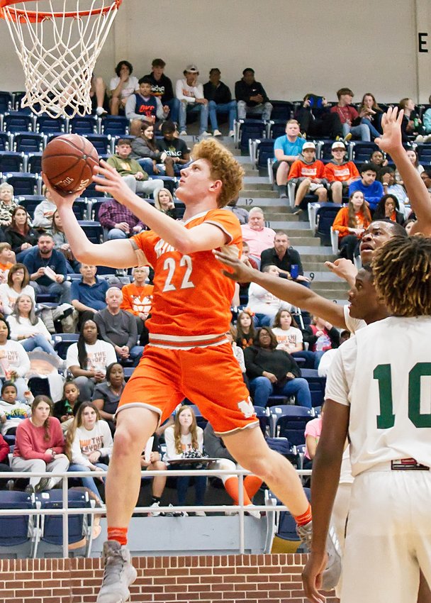 Dawson Pendergrass of Mineola goes in for a layup in the Yellowjackets’ 80-65 bidistrict victory Monday over Gateway Charter Academy from Dallas. Next up for Mineola is the winner between Ponder and Leonard later this week.