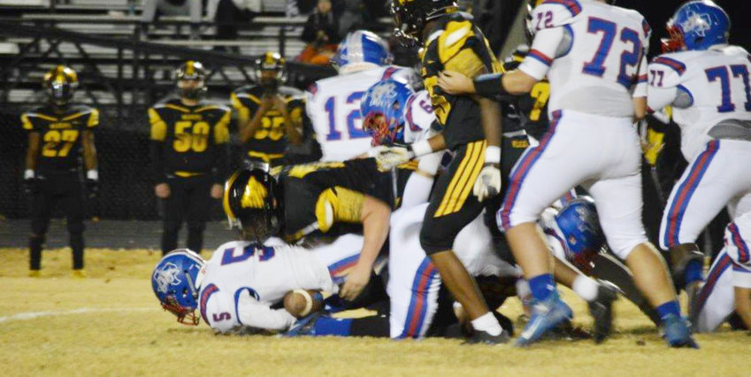 Ty Holland is finally brought down by a Winona defender in Friday’s battle.