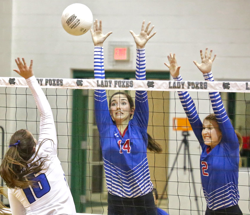 Lady Bulldogs Ava Burroughs and Jentri Jackson defend in the area championship game against Van Alstyne last Friday.