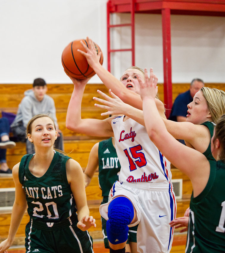 Bella Crawford (15) drives to the basket to score two of her fifteen points on the evening.