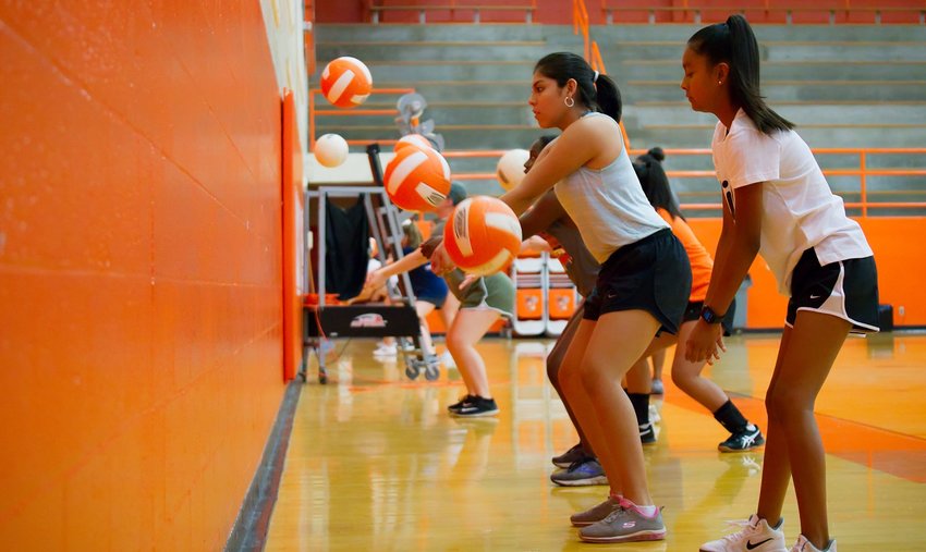 Volleyball drills started shortly after 9 a.m. Monday morning.