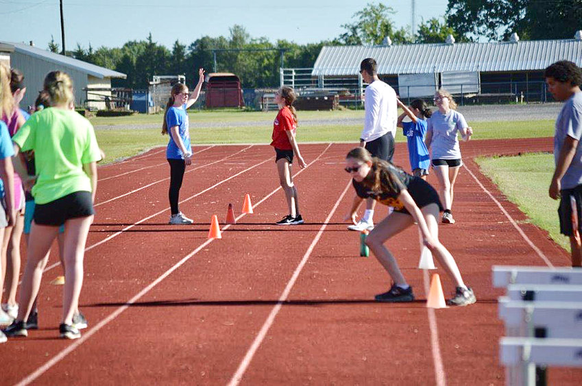 Lady Bulldog athletes join in the summer workoutsunder the watchful eye and direction of Coach Blake Hamrick.