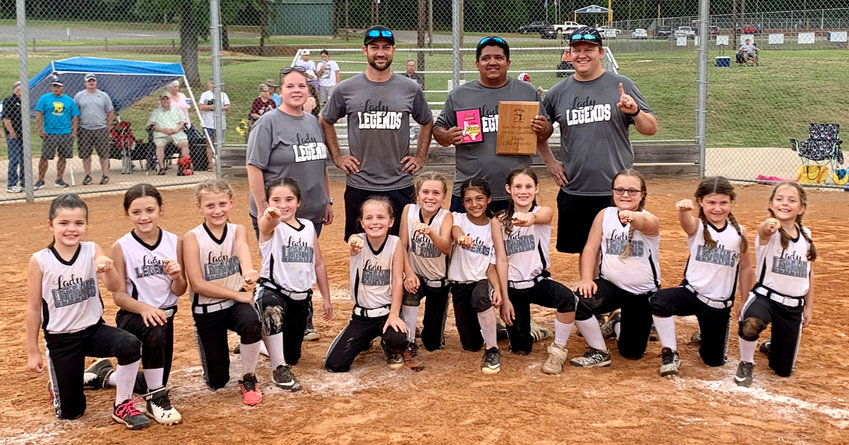The Mineola Lady Legends, from left, Abigail Clark, Kylar Perkins, Kynlie Adams, Alissa Miller, Haylee Glidewell, Brettlee Murray, Abygail Galaz, Kaylee Cook, Kinsler Bowker, Anniston Tibbs and Hazel Goodson; and coaches Alicia Miller, Chase Adams, Cesar Galaz (head coach) and Harley Clark.