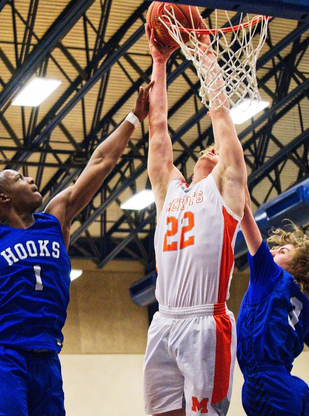 Dawson Pendergrass splits the Hornet defenders to dunk the ball for two of his 17 points.